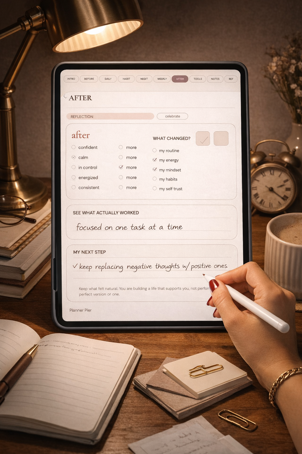 Warm desk mockup showing the after page of the glow up reset planner on an iPad with handwritten reflection notes.
